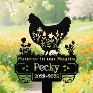 May include: Black metal garden stake featuring a chicken silhouette filled with floral designs. The stake reads "Forever in our Hearts" and "Pecky 2023-2025". The design includes decorative wings and hearts.