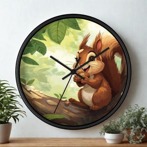May include: A round wall clock with a black frame. The clock face features a cartoon squirrel holding a nut on a tree branch, surrounded by green leaves. The clock hands are black.