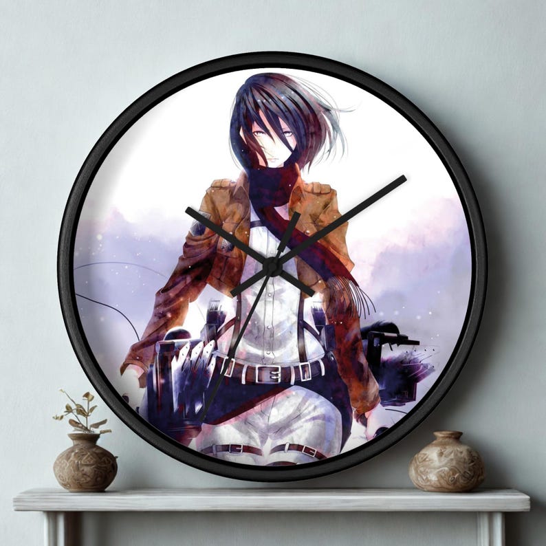 May include: A round wall clock with a black frame. The clock face features an anime-style illustration of a character in a brown jacket, white shirt, and black pants. The clock hands are black.