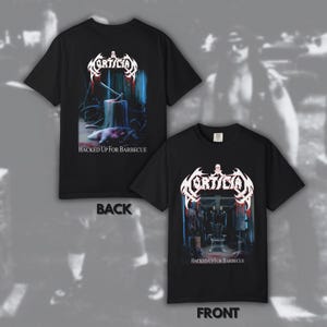 May include: Black t-shirts with a graphic design. The front of the shirt features a graphic with the text "Hacked Up For Barbecue" and the band name "Mortician". The back of the shirt also has a graphic with the same text and band name.