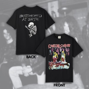 Puede incluir: Dos camisetas negras con diseños gráficos. Una muestra "BUTCHERED AT BIRTH" y un feto esquelético. La otra presenta "CANNIBAL CORPSE" con una ilustración grotesca de figuras en una escena sangrienta.