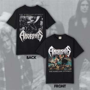May include: Black t-shirts with the band name "Amorphis" in white, stylized lettering. The front of the shirt features a colorful graphic with the text "THE KARELIAN ISTHMUS". The back of the shirt has a black and white graphic and the same text.