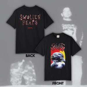 May include: Black t-shirts with graphic designs. One shirt displays "SWOLLEN HEAPS 1995" in red dripping font on the back. The front shirt features a screaming baby with the word "SKINLESS" in a red dripping font.