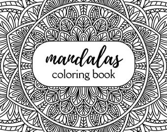 May include: A black and white mandala coloring book with intricate floral and geometric designs. The cover features the text "mandalas coloring book" in a white rectangular frame. The book has 32 pages.