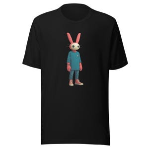 May include: Black t-shirt featuring a cartoon character with a rabbit head, wearing a blue sweater, blue jeans, and pink sneakers. The character has a white face, pink ears, and a small orange button on the sweater.