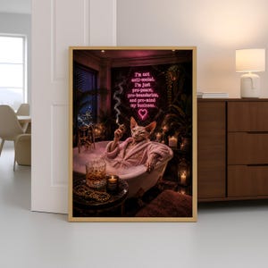 May include: A framed wall art print featuring a Sphynx cat in a bathtub wearing a pink robe, holding a cigarette, with a glass of whiskey and candles nearby. Above the cat, a neon sign reads: I'm not anti-social. I'm just pro-peace, pro-boundaries, and pro-mind my business.