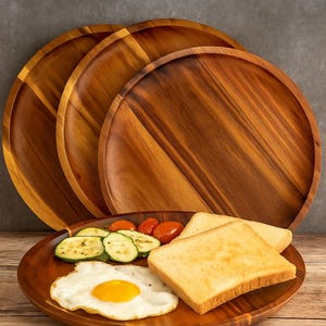 May include: Three round wooden serving platters, with one in the foreground holding a breakfast of fried egg, toast, courgette, and tomatoes. The platters are made of warm-toned wood, ideal for serving food.
