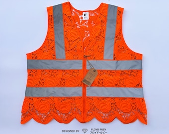 Oranje kanten veiligheidsvest, ontworpen door Floyd Ruby
