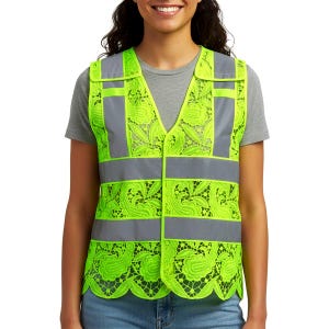 May include: A high-visibility safety vest in neon green with reflective gray stripes and accents. The vest features a decorative lace pattern in the neon green material. The vest has a V-neck and is worn over a gray t-shirt.