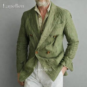 May include: A double-breasted, olive green blazer with brown buttons. The blazer is made of a textured fabric and has a classic lapel design. The word "Lapelien" is printed on the upper left and lower right of the blazer.