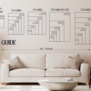 The image is a wall decal displaying a size guide for couches, with a white couch and a coffee table in the foreground.