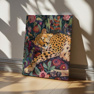 May include: A rectangular canvas print featuring a painting of a spotted cheetah resting amidst a dense, colorful garden of stylized flowers in shades of pink, red, orange, and deep purple. The cheetah is depicted in a reclining position.