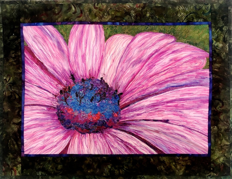 May include: A close-up of a pink flower with a blue and purple centre. The flower has a delicate, almost translucent appearance.
