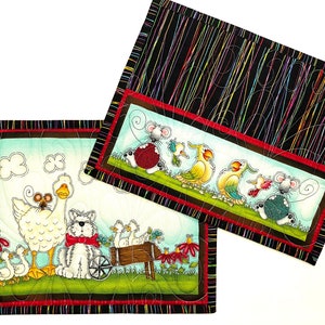 Set of two quilted mini placements or large mug rugs with sweet animal designs that include dog, goose, mice birds and flowers. Printed panels are accented with multi-colored pinstriped fabric on black background. Each mat measure 10-1/2 X 8-1/2