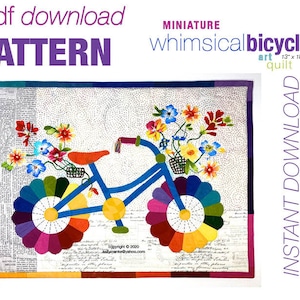 May include: A PDF pattern for a miniature whimsical bicycle quilt, measuring 13 inches by 18 inches. The quilt features a blue bicycle with a basket of colorful flowers, a rainbow-colored wheel, and a white background with black polka dots.