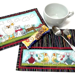 Set of two quilted mini placements or large mug rugs with sweet animal designs that include dog, goose, mice birds, flowers. Printed panels are accented with multi-colored pinstriped fabric on black background. Each mat measures 10-1/2 X 8-1/2 inches