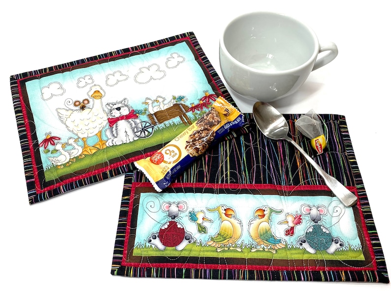 Set of two quilted mini placements or large mug rugs with sweet animal designs that include dog, goose, mice birds, flowers. Printed panels are accented with multi-colored pinstriped fabric on black background. Each mat measures 10-1/2 X 8-1/2 inches