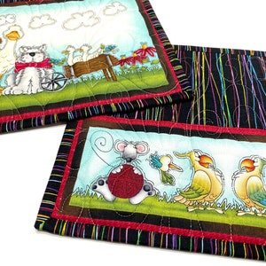 Set of two quilted mini placements or large mug rugs with sweet animal designs that include dog, goose, mice birds and flowers. Printed panels are accented with multi-colored pinstriped fabric on black background. Each mat measure 10-1/2 X 8-1/2