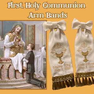 May include: Cream First Holy Communion arm bands with gold chalice and host embroidery. Each band features a bow, gold fringe, and personalised text. The image also includes a religious illustration. The text reads "First Holy Communion Arm Bands".