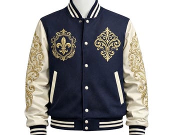 May include: Navy blue varsity jacket with cream-colored sleeves and gold embroidery. The jacket features a fleur-de-lis and ornate designs on the chest and sleeves. It has a striped collar, cuffs, and hem, and a button-up front.
