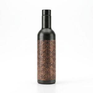 Front view of a 1000ml engraved copper water bottle featuring a sophisticated matte black exterior and ornate antique copper detailing. The tall bottle has a traditional Indian inspired decorative pattern and elegant vintage appearance. Ideal for everyday drinking water, yoga sessions, wellness routines, travel and as a stylish reusable bottle.