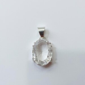 White sapphire energy healing pendant