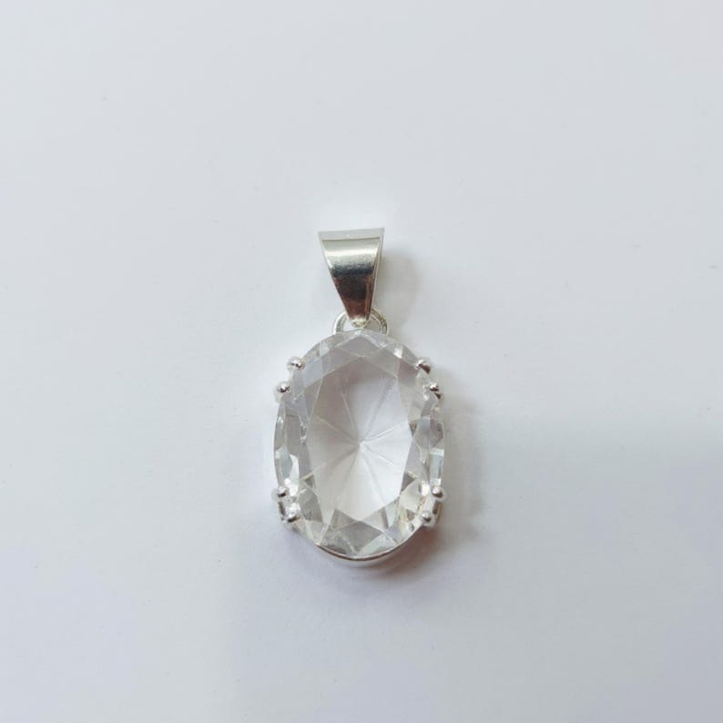 White sapphire energy healing pendant