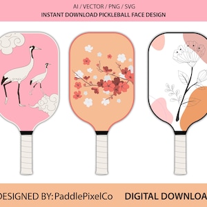 May include: Three pickleball paddles with unique face designs. One paddle features cranes on a pink background, another has cherry blossoms on an orange background, and the third has a floral design on a white background. The text "AI / VECTOR / PNG / SVG" and "INSTANT DOWNLOAD PICKLEBALL FACE DESIGN" is at the top.
