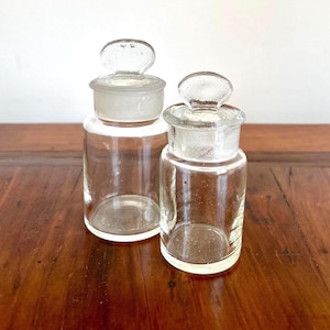 Two small, rare glass jars with lids, made in Italy in 1900. Multipurpose.