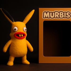 May include: A yellow plush toy with large, cartoonish features stands next to a brown box. The toy has large eyes, a red mouth, and black-tipped ears. The box has the word "MURBIS" printed on it.