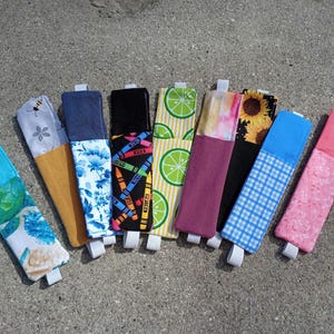 Sujetapáginas con elástico y portalápices