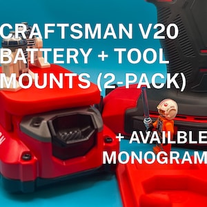 May include: Red Craftsman V20 battery and tool mounts, with the text "CRAFTSMAN V20 BATTERY + TOOL MOUNTS (2-PACK)". The image also includes a black and red power tool and a small toy figure. The text "+ AVAILABLE MONOGRAM" is also visible.