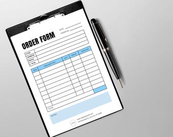 May include: A black clipboard with an order form and a black pen. The order form has sections for name, address, and item descriptions. The text "ORDER FORM" is at the top. The pen is lying on a gray surface.