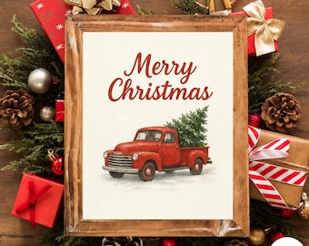 May include: A framed print with the words "Merry Christmas" and a red truck carrying a Christmas tree. The print is surrounded by festive decorations, including pine branches, gift boxes, and ornaments, creating a holiday theme.