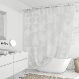 May include: A white shower curtain with a geometric triangular pattern hangs in a modern bathroom. The curtain is paired with a white bathtub, sink, and vanity. A mirror and faucet are visible on the wall. The bathroom has a minimalist design.