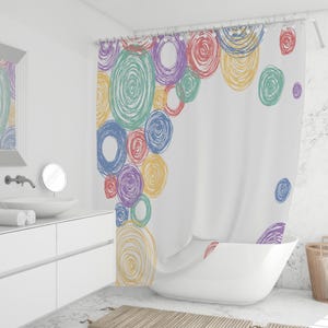 May include: White shower curtain with a colorful spiral circle design in shades of red, blue, green, yellow, and purple. The curtain is hanging in a modern bathroom setting with a white tub and sink.