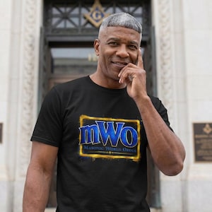 May include: Black t-shirt with a gold-bordered graphic that reads "mWo Masonic World Order" in blue and white. The shirt is short-sleeved and worn by a person.
