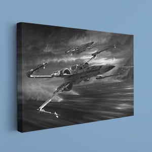 May include: A rectangular canvas wall art print featuring a black and white illustration of two X-wing starfighters in flight over a turbulent sea. The scene depicts the aircraft with wings in attack position against a dark, cloudy, stormy sky.