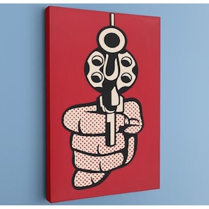 May include: Pop art style canvas print featuring a black and white revolver aimed forward against a red background. The hand holding the gun is depicted with a dotted pattern.