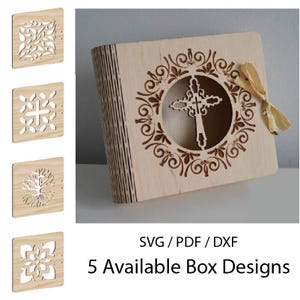 May include: A light brown wooden box with a laser-cut cross design, tied with a gold ribbon. The box has intricate cut-out patterns. The image also shows four additional box designs with different patterns. Text on the image reads "SVG / PDF / DXF" and "5 Available Box Designs."