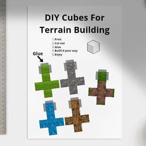 以下が含まれることがあります： 「DIY Cubes For Terrain Building」のテキストと説明が書かれた白いシート。緑、グレー、茶色、青色の十字型のキューブデザインが示されており、左側に定規があります。