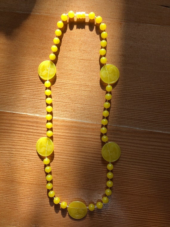 Unique 1940s all plastic celluloid coin necklace