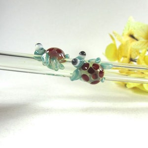 Twin Turtles on a Clear Glass Drinking Straw