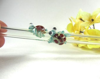 Twin Turtles on a Clear Glass Drinking Straw