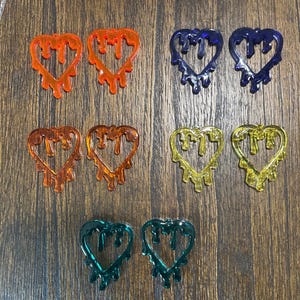 resin drippy heart earrings.