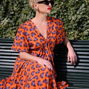 Orange Midi Dress with Blue Flowers • V-Neck • Sleeveless • Lightweight & Flowing • Elegant and Comfortable for Summer Days