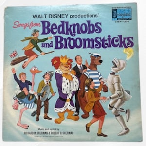 May include: Vintage vinyl record album cover for "Bedknobs and Broomsticks" by Walt Disney Productions. The cover features colorful illustrations of characters from the film, including a witch on a broom, a lion, and a bear. The album is labeled "STER-1326".