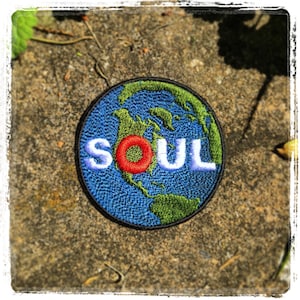 Soul Planet handmade iron on patch.  Made from Recycled materials. Custom Embroidery