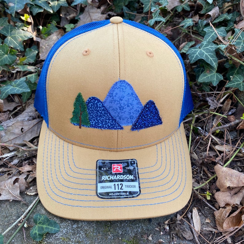 Handcrafted Blue Ridge Fabric Mountains trucker hat. Richardson 112. Made from Upcycled materials Biscuit/Blue