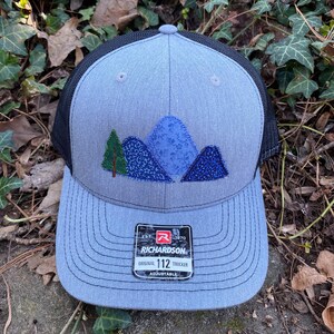 Handcrafted Blue Ridge Fabric Mountains trucker hat. Richardson 112. Made from Upcycled materials Hthr Gry/Blk